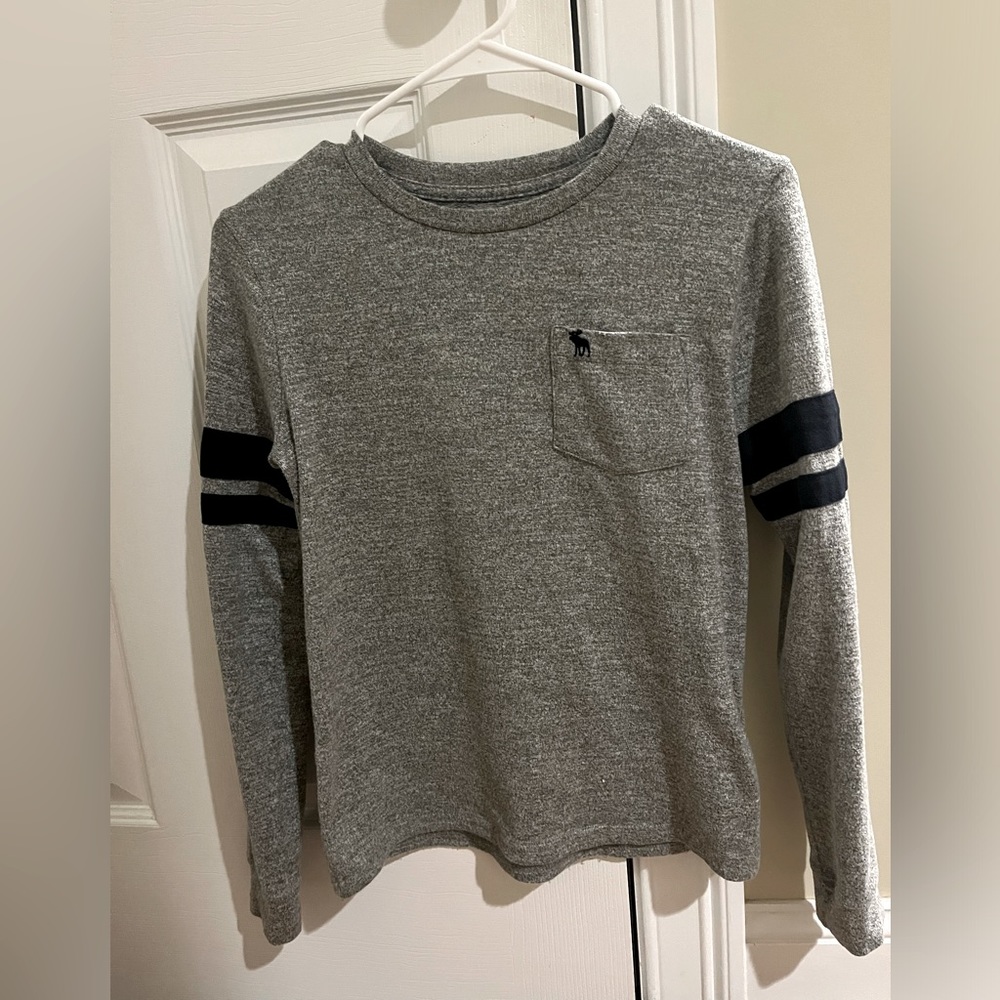 Abercrombie kid gray crew shirt with dark blue strips on arms. Very soft.size 13